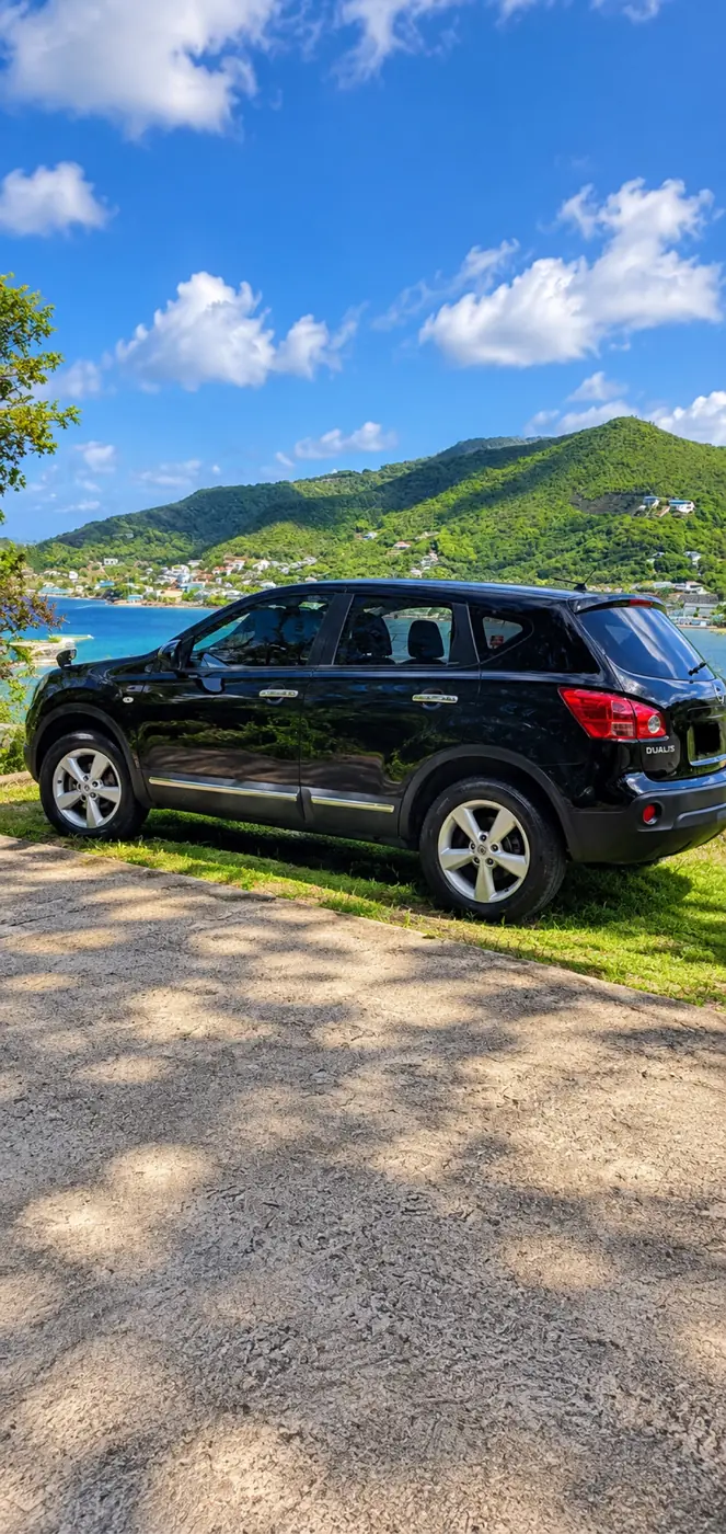 Black Nissan Dualis compact SUV in Bequia